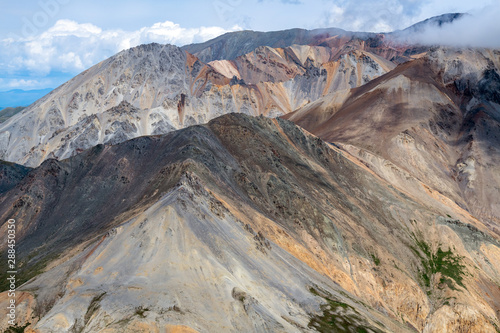 Colorful mountains in the clouds in Kluane National Park, Yukon, Canada