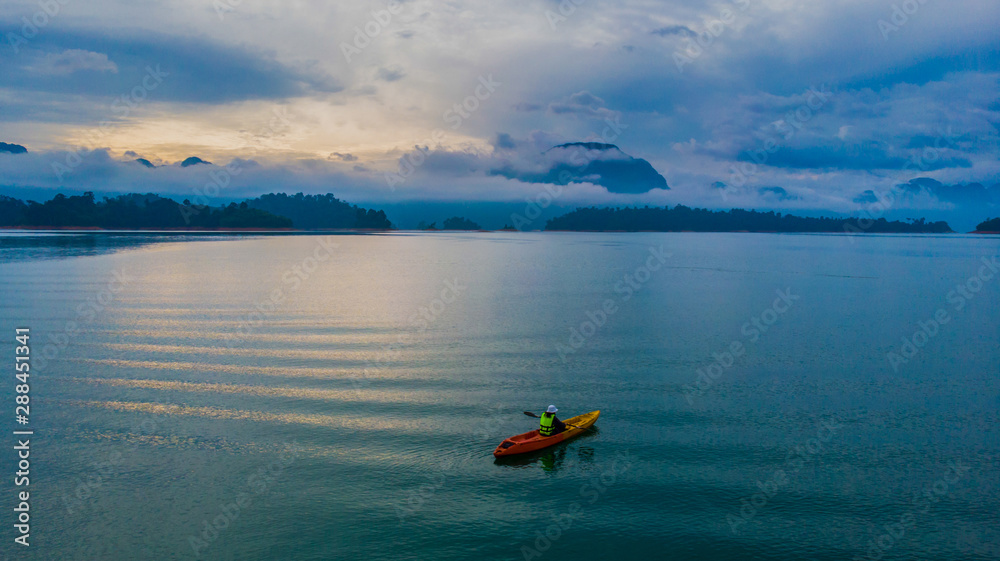 Fototapeta premium Kayaking on a lake aerial view water green
