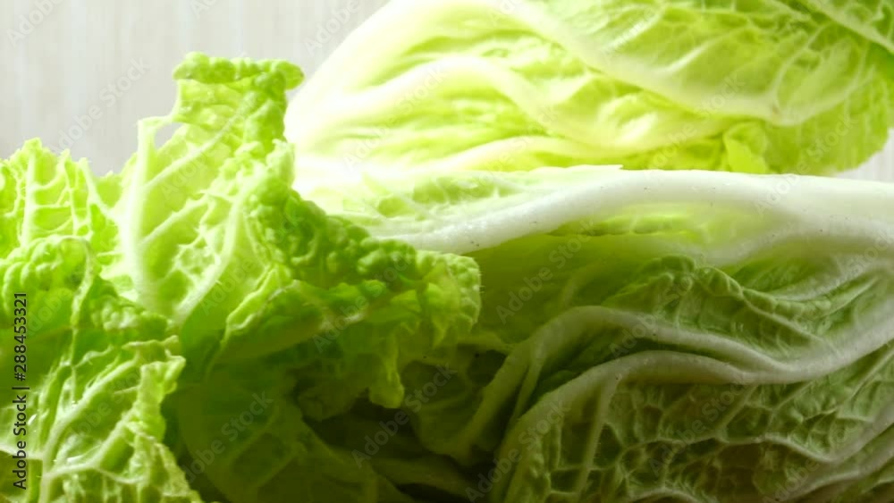 Napa cabbage, shooting in the movement. Cuttig board. Napa cabbage, shooting in the movement. Cuttig board.