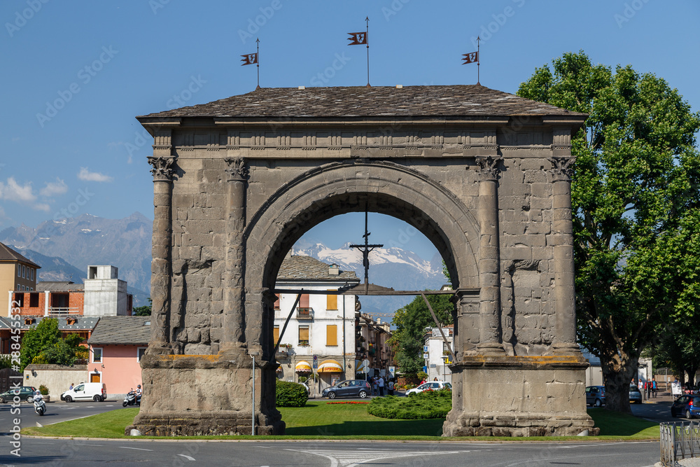 AOSTA / ITALY - JULY 2015: Ruins of Roman Triumphal arch in Aosta town, Italy