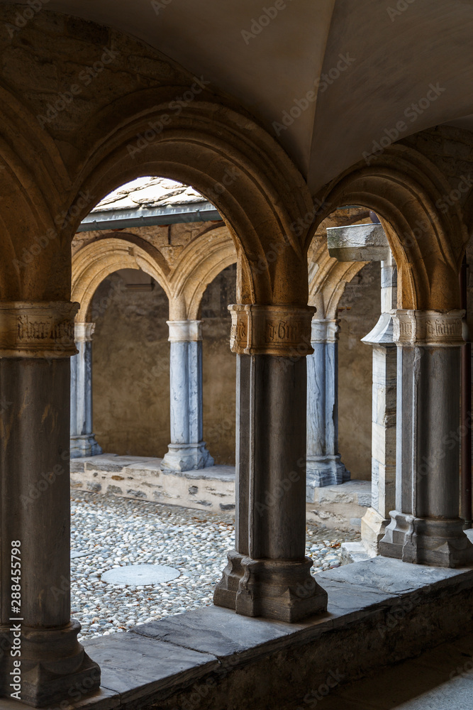 Obraz premium AOSTA / ITALY - JULY 2015: Cloister of a church in the historic centre of Aosta town, Italy
