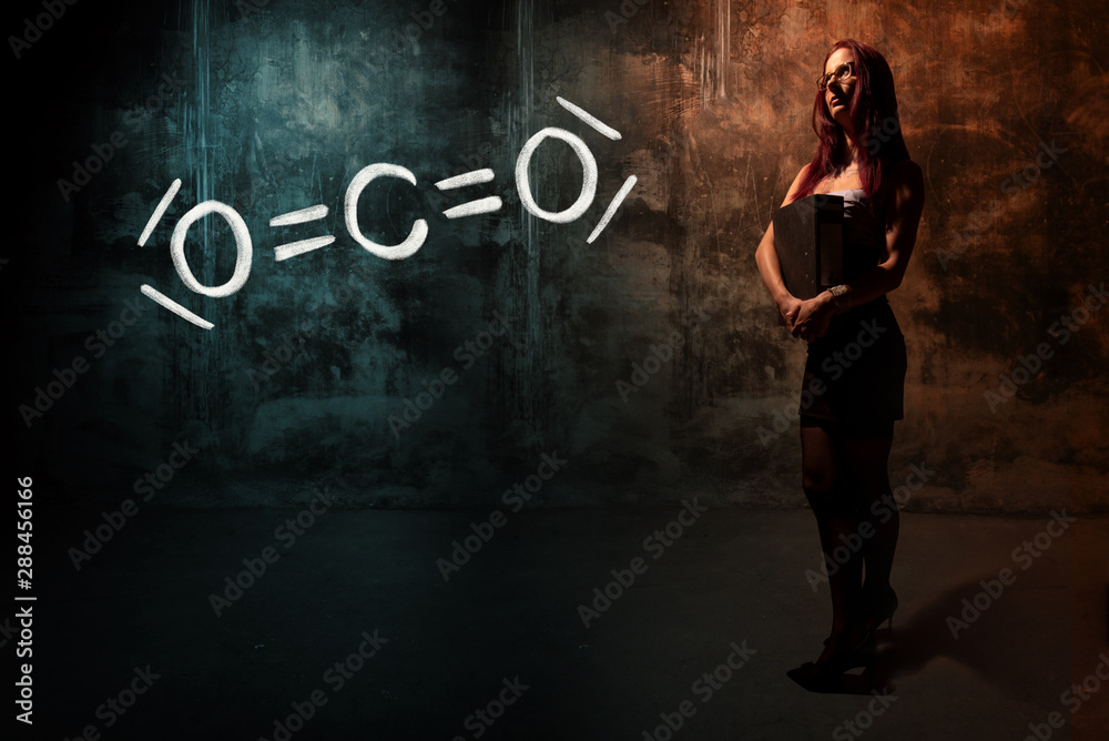 Sexy girl or secretary or female student presenting handdrawn chemical formula of co2 Sexy girl or secretary or female student presenting handdrawn chemical formula of co2