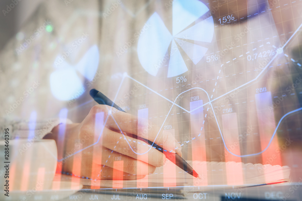 Forex chart displayed on woman's hand taking notes background. Concept of research. Multi exposure Forex chart displayed on woman's hand taking notes background. Concept of research. Multi exposure
