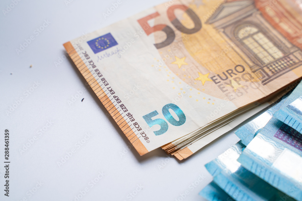 Pile bundle of euro bills money note on white background