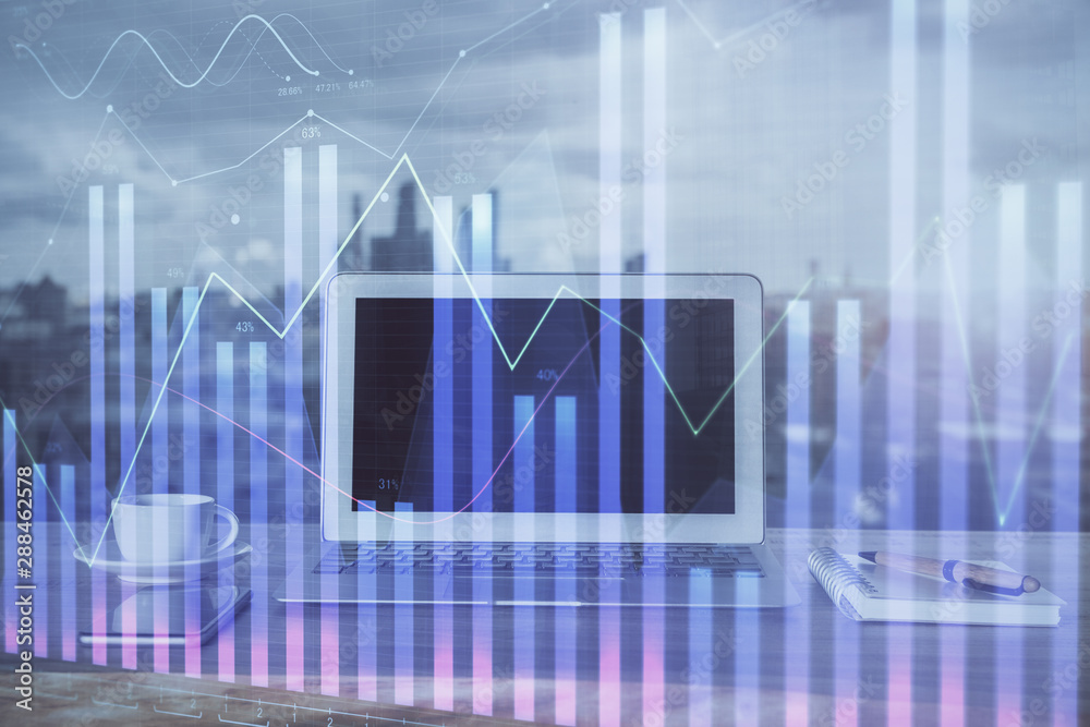 Forex graph hologram on table with computer background. Multi exposure. Concept of financial markets. Forex graph hologram on table with computer background. Multi exposure. Concept of financial markets.
