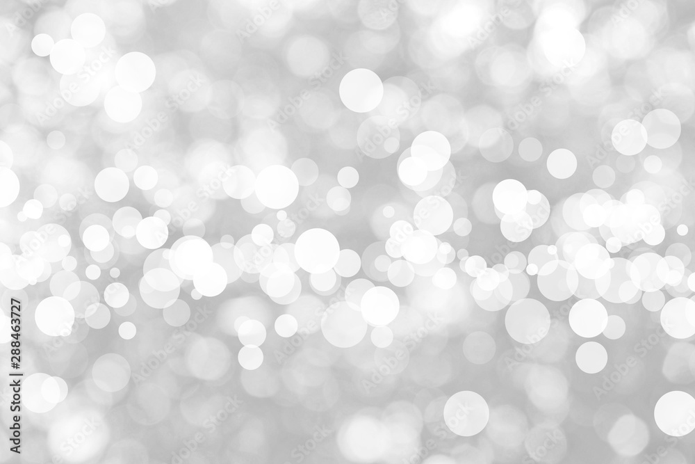 Abstract background with White bokeh on gray background. christmas blurred beautiful shiny Christmas lights. Abstract background with White bokeh on gray background. christmas blurred beautiful shiny Christmas lights.