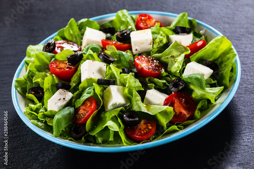 Greek salad on stone background
