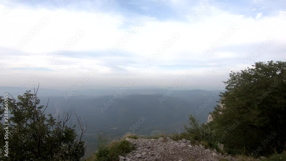 Slowly hiking downhill through rocky path from Nanos Slovenia mountain Slowly hiking downhill through rocky path from Nanos Slovenia mountain
