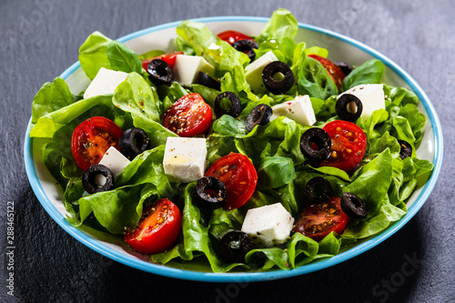 Greek salad on stone background