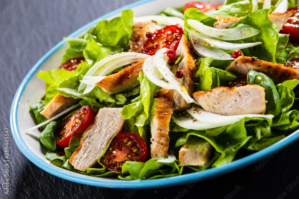 Caesar salad on stone table Caesar salad on stone table