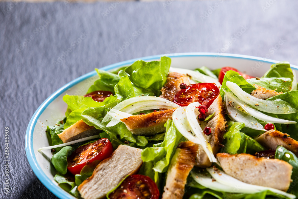 Caesar salad on stone table Caesar salad on stone table