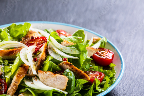 Caesar salad on stone table © Jacek Chabraszewski