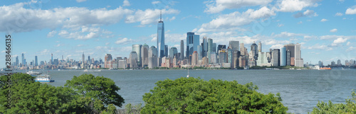 New York, NY, USA. Amazing skyline of Manhattan skyscrapers and buildings from Ellis Island. Landscape inclusive of the Freedom tower - One World Trade Center
