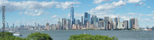 New York, NY, USA. Amazing skyline of Manhattan skyscrapers and buildings from Ellis Island. Landscape inclusive of the Freedom tower - One World Trade Center