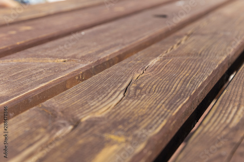 The texture of a wooden board on a bench