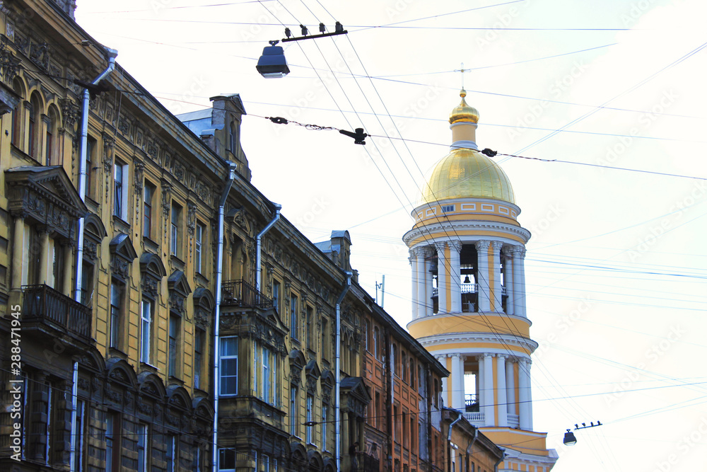 City street with old houses and Vladimirskaya church in Saint Petersburg, Russia. Close up buildings details and lifestyle city scene with classic russian architecture
