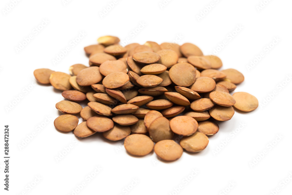 Isolated stack of uncooked lentils on white background from above. Isolated stack of uncooked lentils on white background from above.