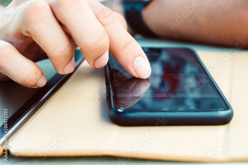 image of people using a smartphone.