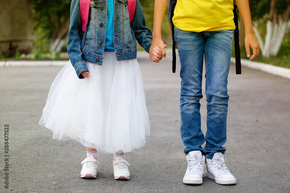 Boy and girl go to school together Stock Photo | Adobe Stock