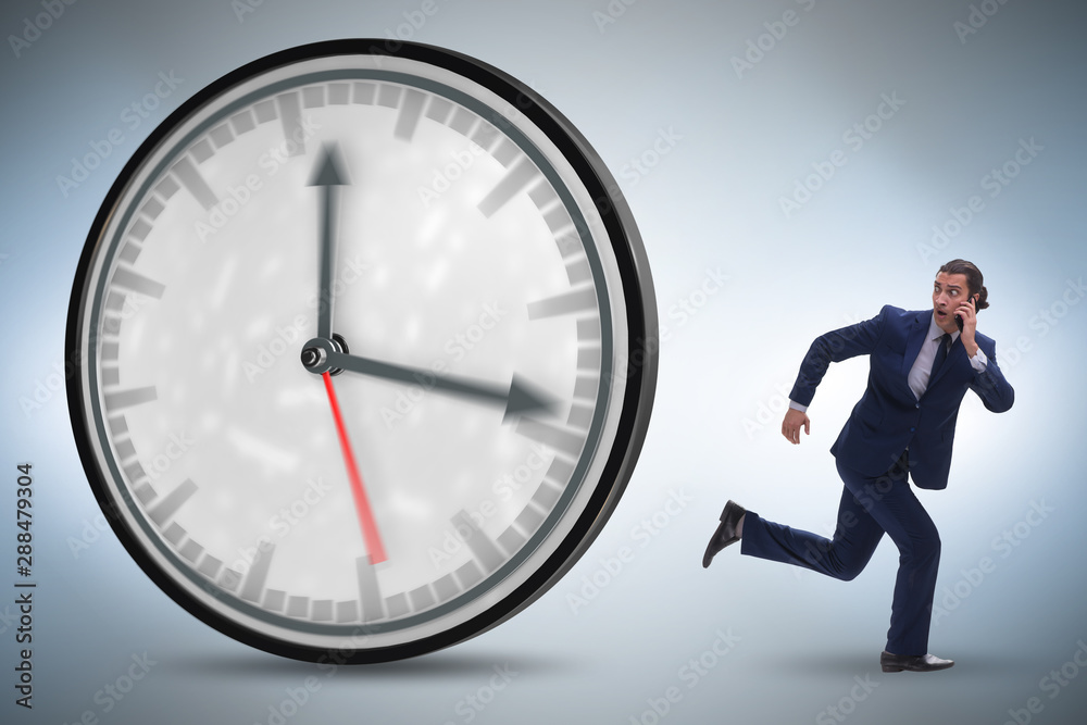 Businessman employee in time management concept Businessman employee in time management concept