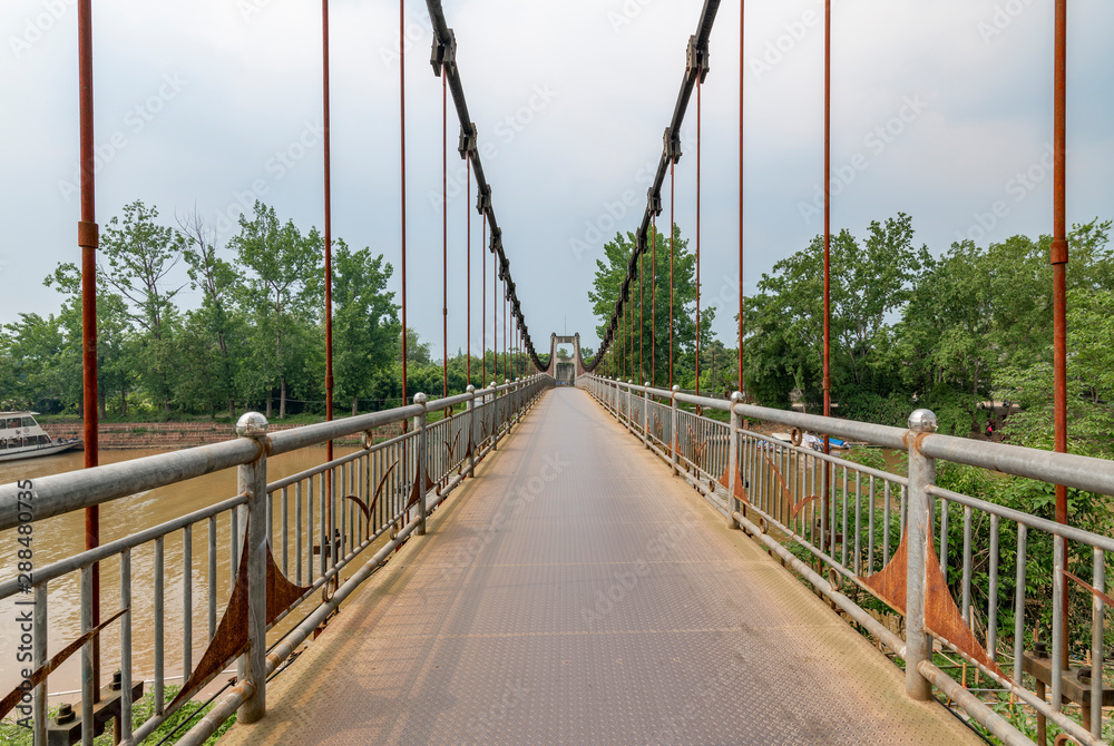 Obraz premium Iron rope suspension bridge in the ancient town of Huanglongxi, Chengdu, Sichuan Province, China