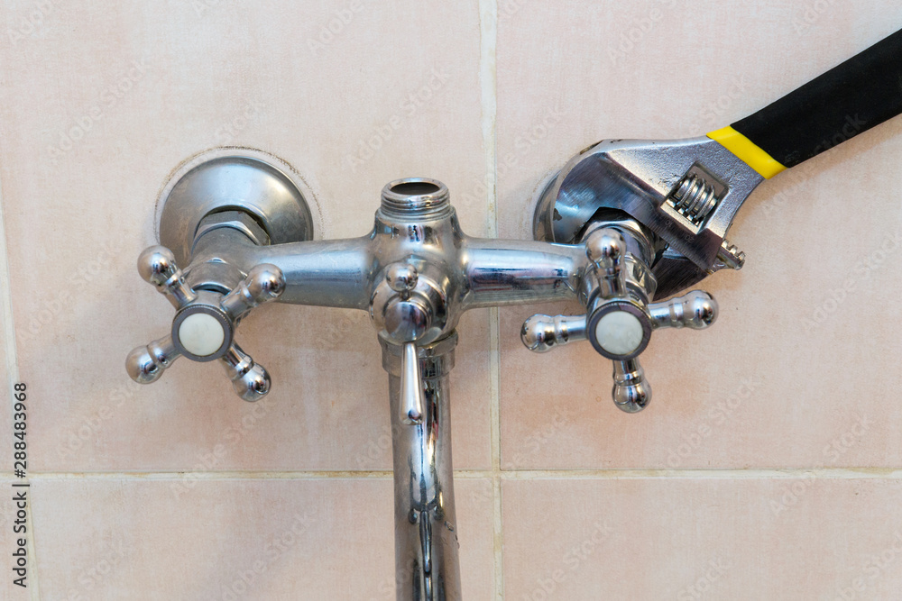 The concept of repair and replacement of the mixer in the bathroom. Old faucet mixer in the bathroom. The concept of repair and replacement of the mixer in the bathroom. Old faucet mixer in the bathroom.