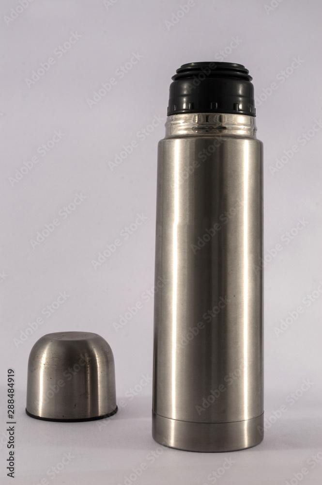 Stainless steel vacuum flask isolated on the white background Stainless steel vacuum flask isolated on the white background