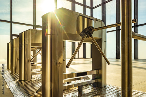Electronic turnstile. Access system to the building. Pass through the passes. Security systems for rooms. Several turnstiles are installed nearby. Check Point. Automatic checkpoint. Building security.