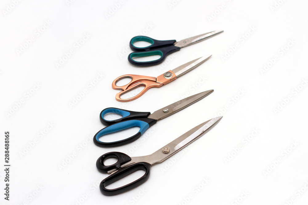 group of scissors on a white background group of scissors on a white background