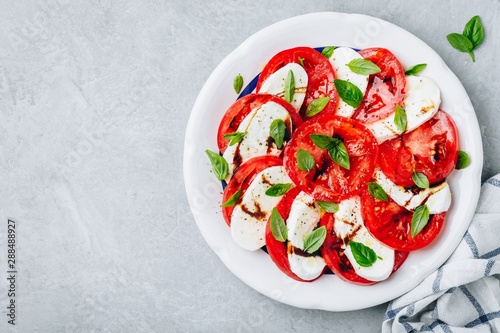 Tomato, basil, mozzarella Caprese salad with balsamic vinegar and olive oil.