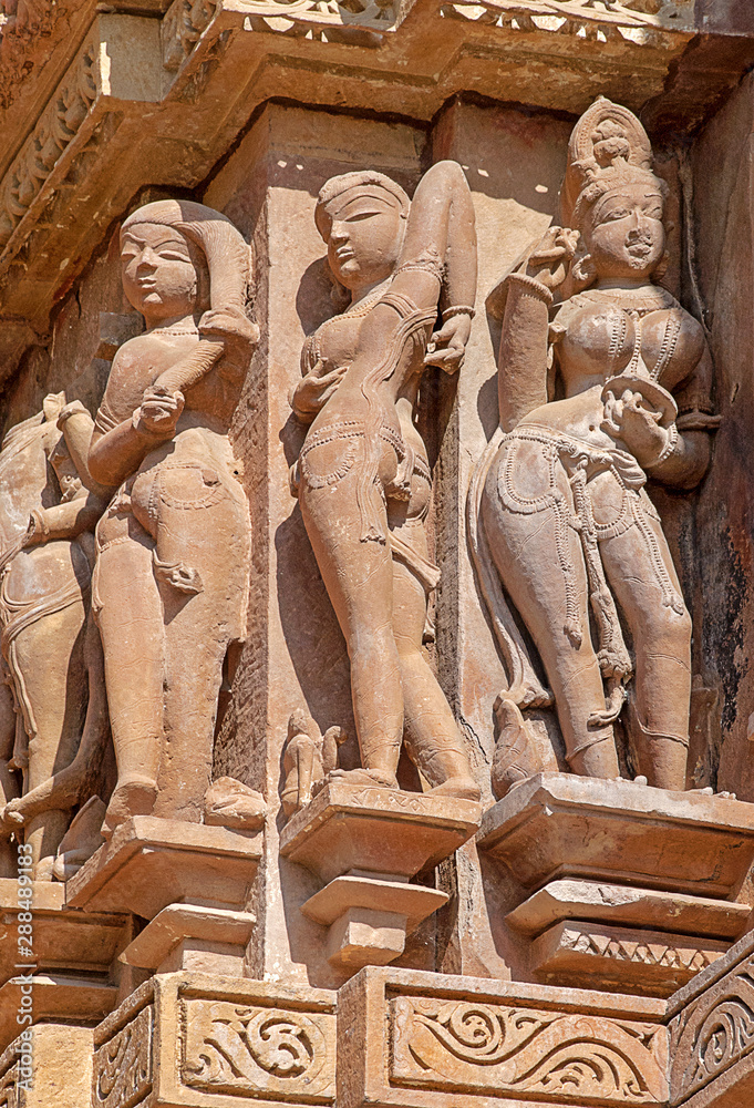 Sculptures on the walls of famous Khajuraho Temples in India. Khajuraho Temples are one of the UNESCO World Heritage Sites in India. The temples are famous for their Nagara-style architectural symboli