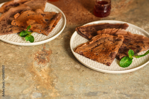 pancakes chocolate (fritter with cocoa, delicious breakfast dessert) menu concept. food background. copy space. Top view