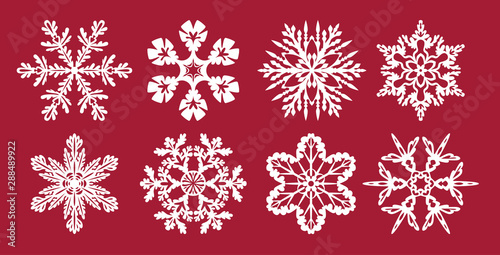Set of  snowflakes. Christmas or New Year decoration. Templates for laser cutting, plotter cutting or printing. Vector illustration. Elements of festive background.