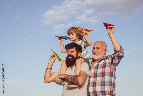 Men generation. Father , son with grandfather - happy loving family.