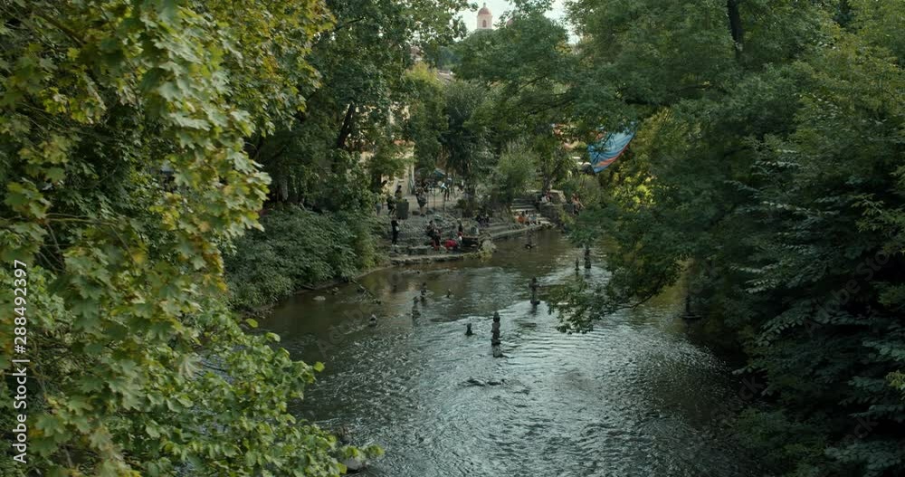 small river in Vilnius, tracking shot small river in Vilnius, tracking shot