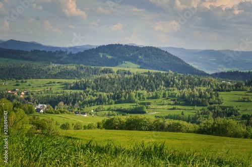 Beautiful spring green landscape. View of the charming villages in the mountains. © shadowmoon30