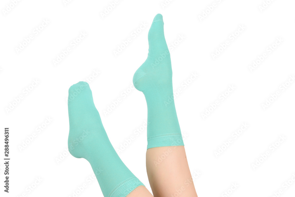 Woman in blue socks isolated on white background. Top view. Woman in blue socks isolated on white background. Top view.