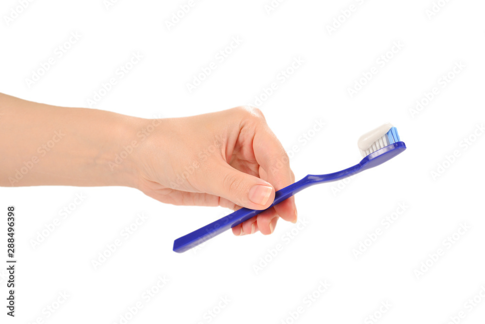 Woman holds toothbrush with toothpaste in her hand isolated on white background. Woman holds toothbrush with toothpaste in her hand isolated on white background.