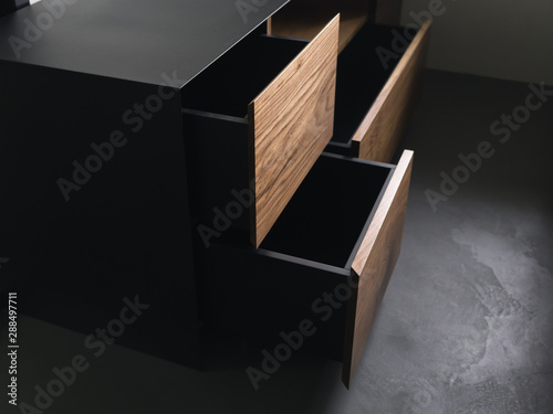 Closeup details of modern tv stand made from walnut and powder coated steed