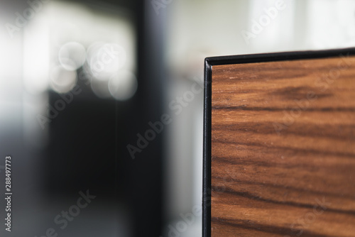 Closeup details of modern tv stand made from walnut and powder coated steed