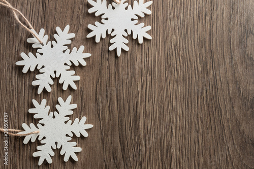Christmas background with white snowflakes, Christmas frame made of wooden toys