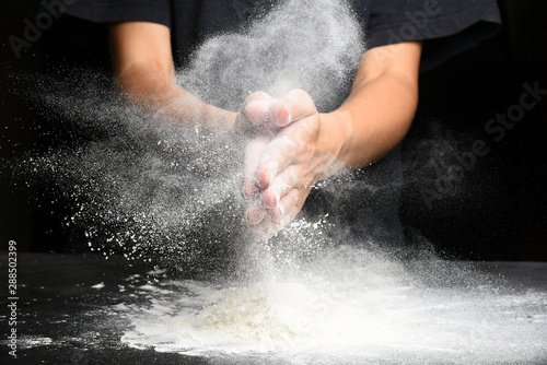 Cook's hands do is clapping with flour
