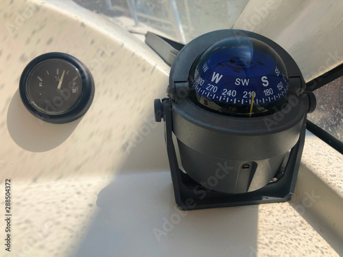 Marine device on a yacht - the hero compass shows the direction of movement, navigation in the ocean. Safety of sailing first, the idea of ??travel.