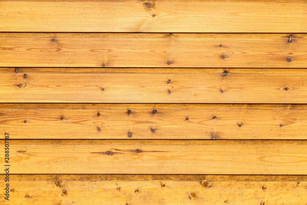Naklejka premium Wooden planks with natural patterns as background
