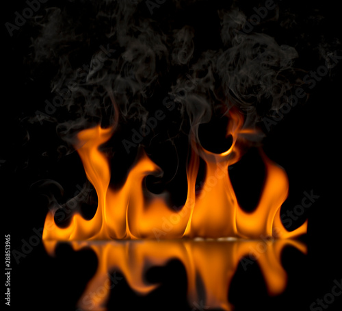 The flame on the black background has a shadow of the flame. © WIROT