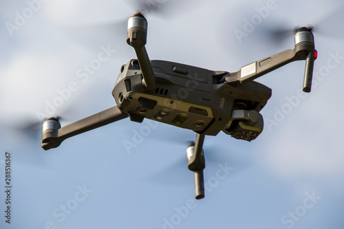 drone quad copter with high resolution digital camera on the sky