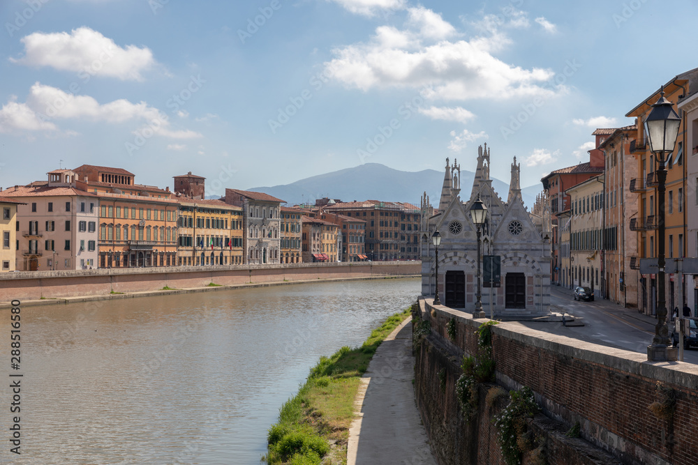 Panoramic view on historic center of Pisa city and river Arno