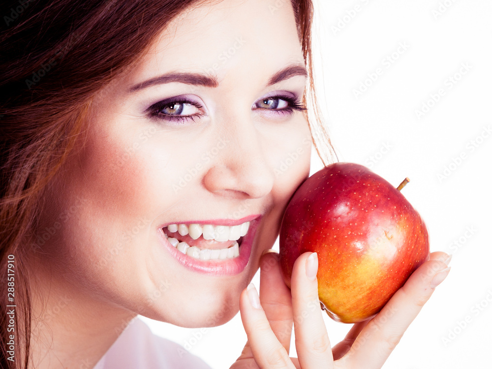 Woman holds apple fruit close to face, isolated Woman holds apple fruit close to face, isolated