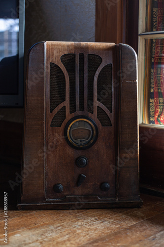 Old fashion style vintage retro radio in wood indoors