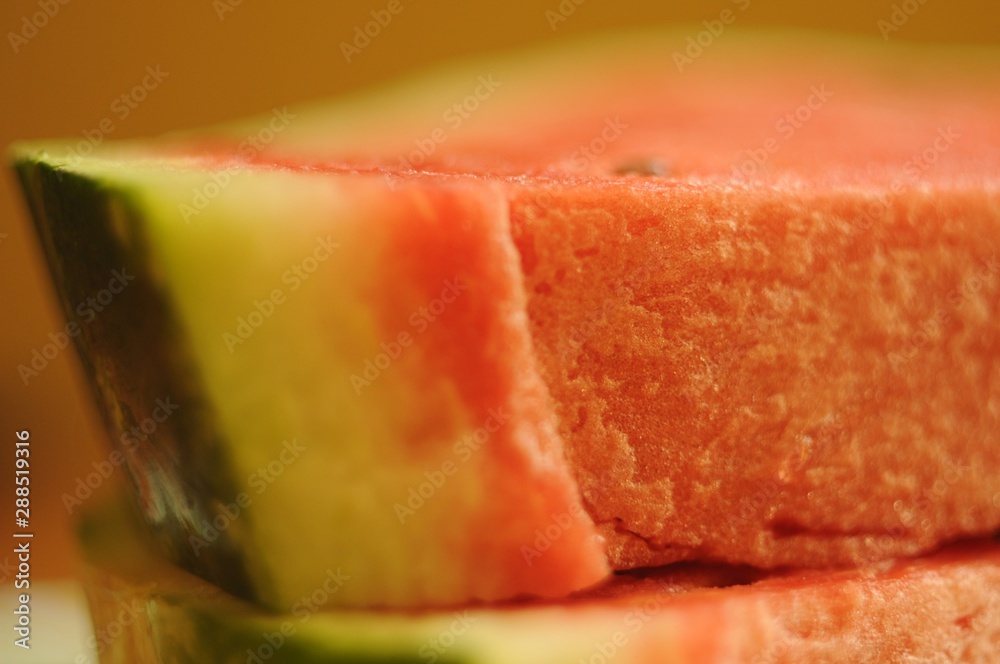 Slices of sugar watermelon lying on top of each other, closeup. Slices of sugar watermelon lying on top of each other, closeup.